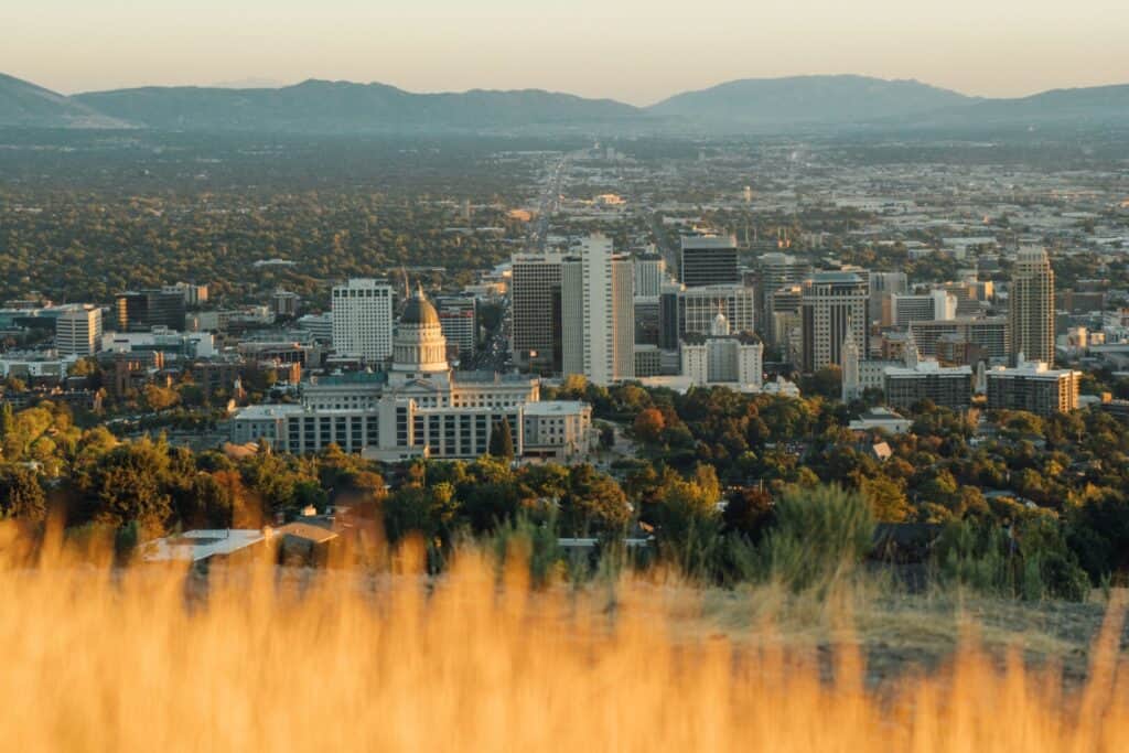 Aerial view of Salt Lake City skyline with junk removal and cleanout services in the foreground.
